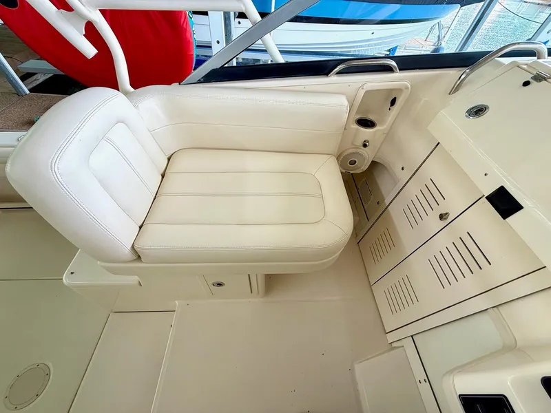 Slide: The Image of 2018 Grady-White Marlin 300 boat interior with white seating and storage compartments. - 30