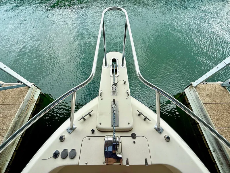 Slide: The Image of Bow view of 2018 Grady-White Marlin 300 at dock, calm water. - 37