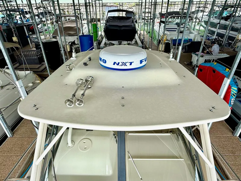 Slide: The Image of 2018 Grady-White Marlin 300 boat docked in a marina, top view. - 38