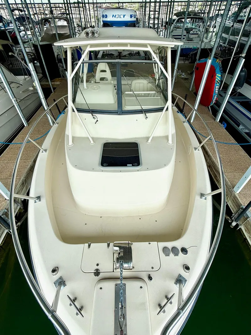 Slide: The Image of 2018 Grady-White Marlin 300 boat docked in marina, top view. - 39