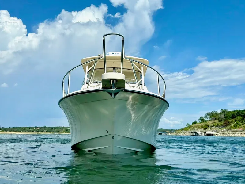Slide: The Image of 2018 Grady-White Marlin 300 boat on water, clear sky background. - 4