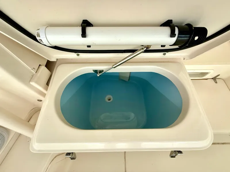 Slide: The Image of Livewell on 2018 Grady-White Marlin 300 boat, open with blue interior. - 41