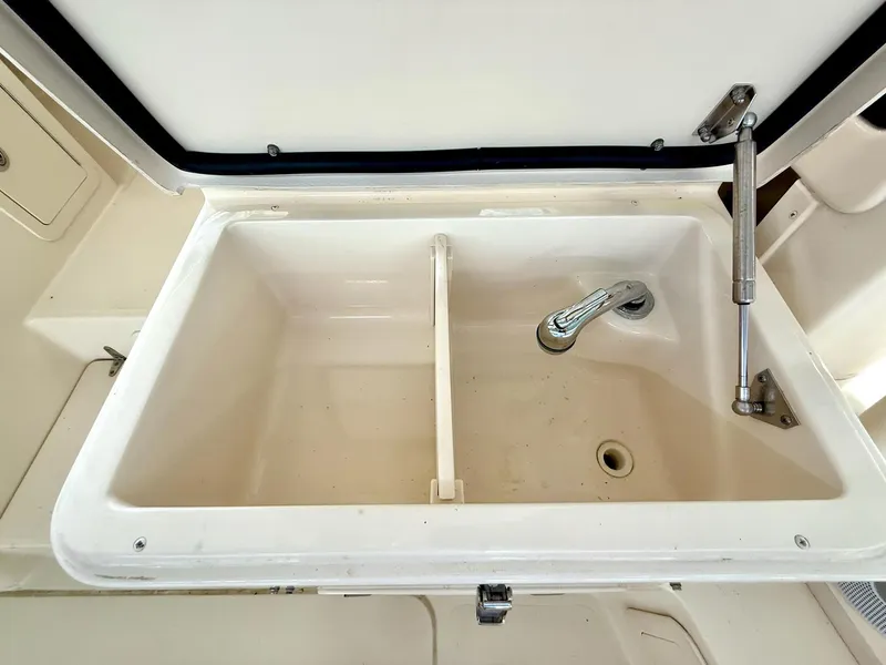 Slide: The Image of 2018 Grady-White Marlin 300 boat sink with faucet and drain. - 42