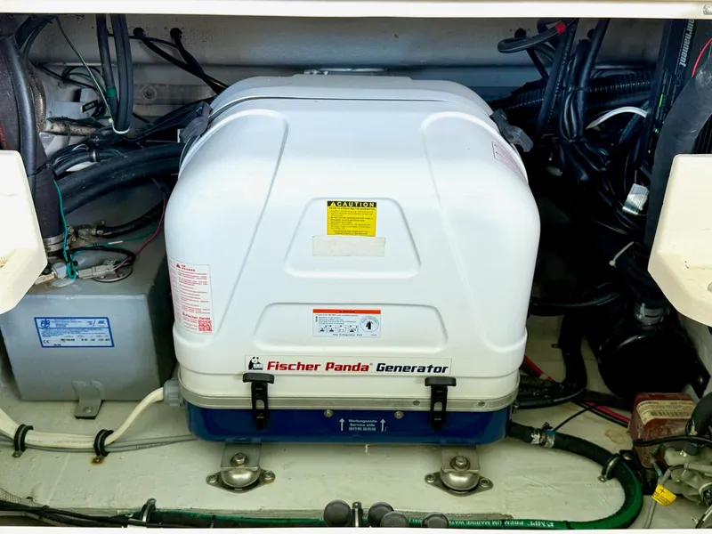 Slide: The Image of Fischer Panda generator in 2018 Grady-White Marlin 300 boat engine compartment. - 44