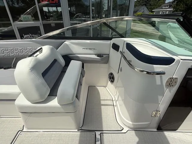 Slide: The Image of 2026 Regal LS6 boat interior with white seating and sleek design. - 12
