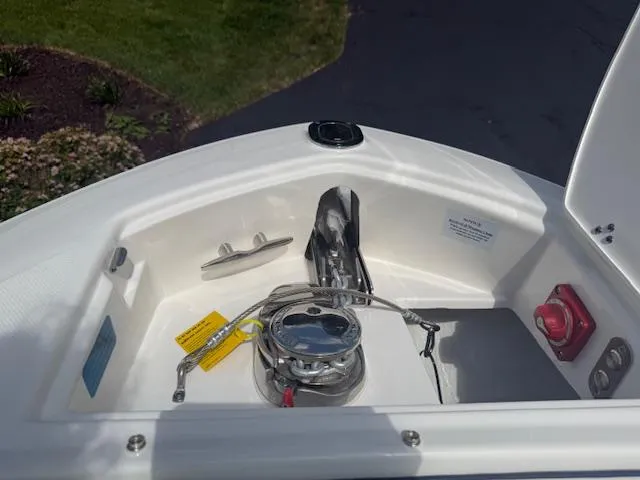 Slide: The Image of 2026 Regal LS6 boat anchor compartment with winch and control panel. - 21