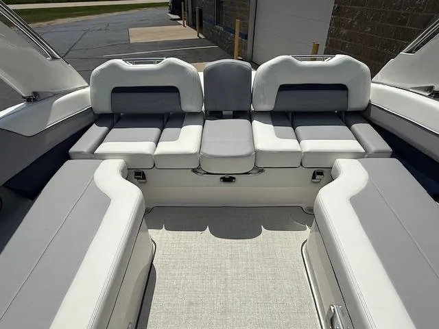 Slide: The Image of 2026 Regal LS6 boat interior with luxurious white seating and modern design. - 24