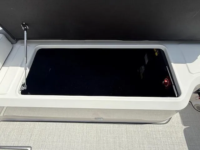 Slide: The Image of Open storage compartment in 2026 Regal LS6 boat. - 29