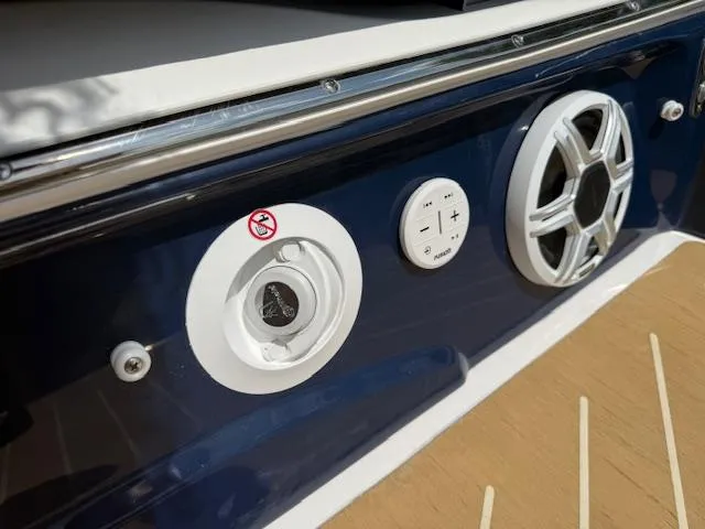 Slide: The Image of 2026 Regal LS6 boat audio controls and speaker on deck. - 31