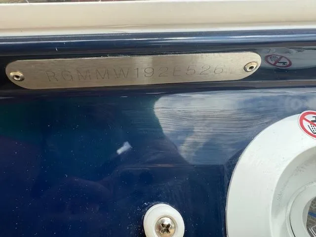 Slide: The Image of 2026 Regal LS6 boat hull identification number plate on a blue surface. - 38