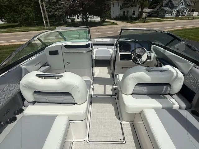 Slide: The Image of 2026 Regal LS6 boat interior with luxurious white seating and modern dashboard design. - 7