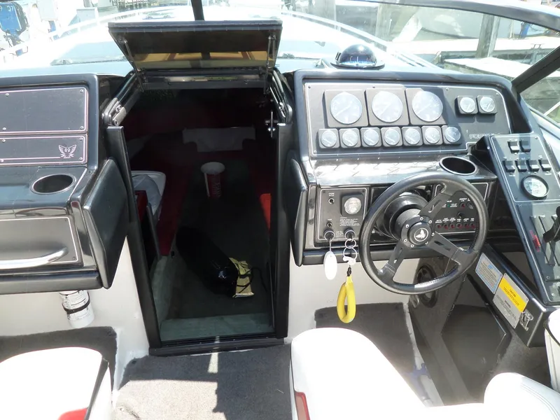 Slide: The Image of 1989 Formula F272 SR 1 boat cockpit with steering wheel and control panel. - 11