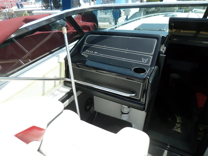 Slide: The Image of Interior of a 1989 Formula F272 SR 1 boat, featuring dashboard and seating. - 12