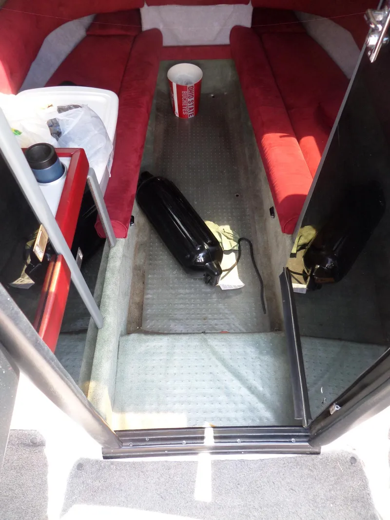 Slide: The Image of Interior of 1989 Formula F272 SR 1 boat with red seating and equipment. - 16