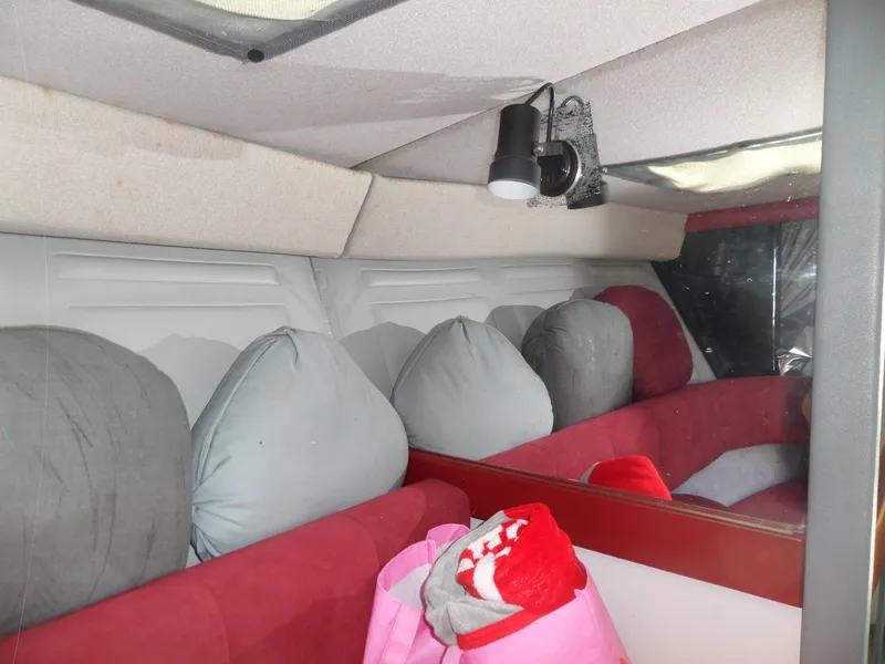 Slide: The Image of Interior of a 1989 Formula F272 SR 1 boat with cushions and a light fixture. - 17