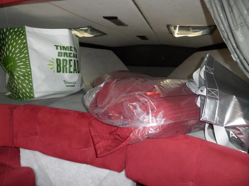 Slide: The Image of Interior of a 1989 Formula F272 SR 1 boat with bags and red cushions. - 20