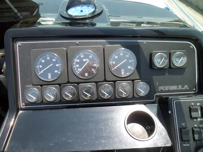 Slide: The Image of Dashboard of a 1989 Formula F272 SR 1 boat with gauges and controls. - 7