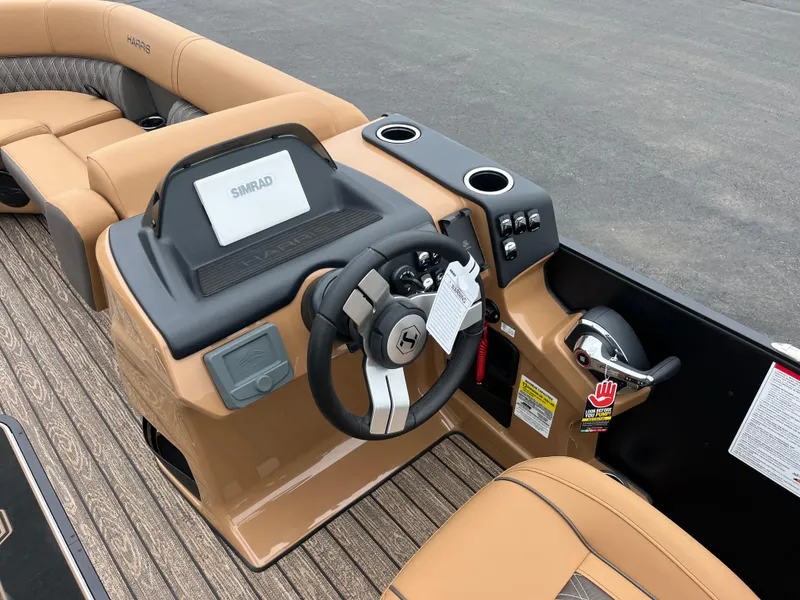 Slide: The Image of 2026 Harris Cruiser 230 boat dashboard with steering wheel and control panel. - 6