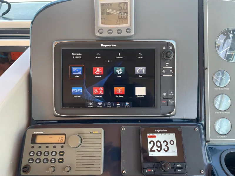 Slide: The Image of Control panel of a 1998 Tiara Yachts 3500 Open with Raymarine navigation system. - 12