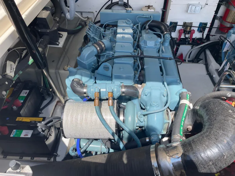 Slide: The Image of Engine compartment of a 1998 Tiara Yachts 3500 Open, showcasing marine engine and components. - 35