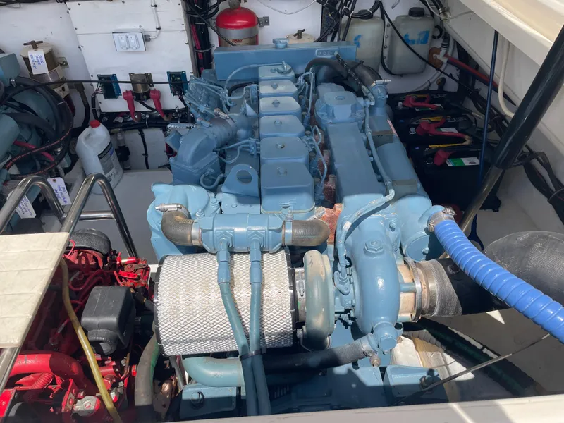 Slide: The Image of Engine compartment of a 1998 Tiara Yachts 3500 Open, showcasing a well-maintained marine engine. - 36