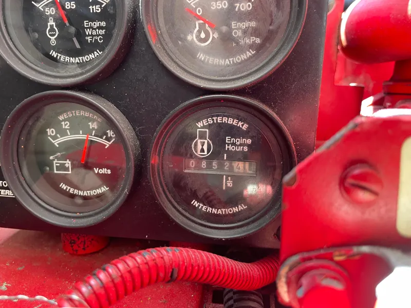 Slide: The Image of Close-up of 1998 Tiara Yachts 3500 Open engine gauges displaying engine hours and voltmeter. - 37