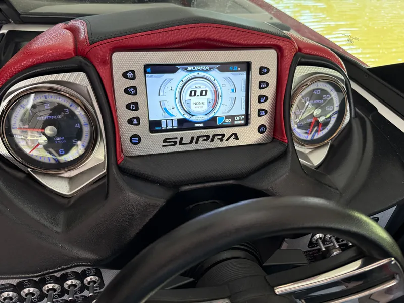 Slide: The Image of Dashboard of a 2015 Supra SE450-550 boat with digital display and gauges. - 17