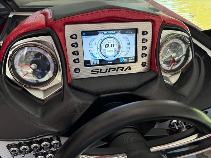 Slide: The Image of 2015 Supra SE450-550 dashboard with digital display and analog gauges. - 18
