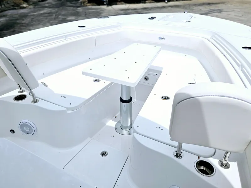Slide: The Image of 2025 Sea Hunt Gamefish 28 FS boat interior with seating and table. - 33