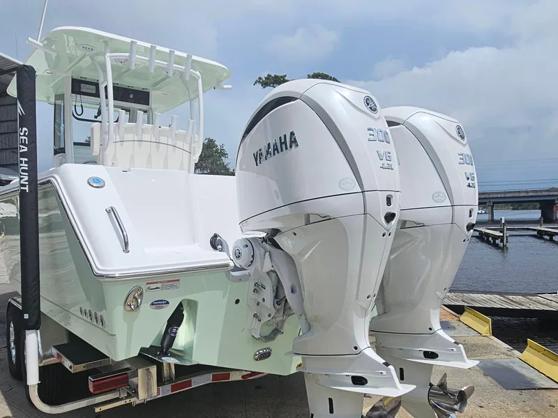Slide: The Image of 2025 Sea Hunt Gamefish 28 FS boat with twin Yamaha 300 V6 engines at dock. - 39