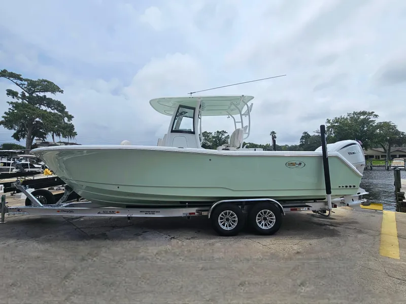 Slide: The Image of 2025 Sea Hunt Gamefish 28 FS boat on trailer, dockside view. - 5
