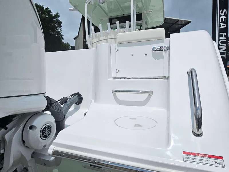 Slide: The Image of 2025 Sea Hunt Gamefish 28 FS boat deck with seating and storage. - 7
