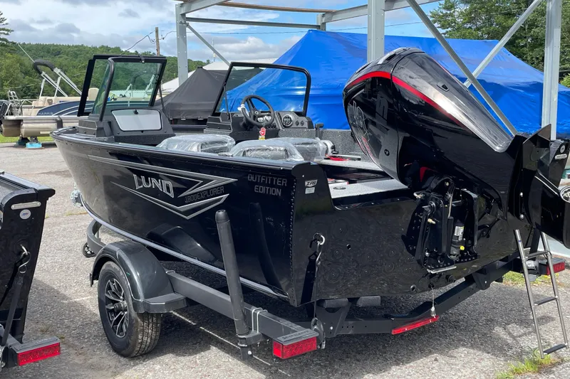 Slide: The Image of 2026 Lund 1800 Explorer Sport boat with outboard motor on trailer. - 10