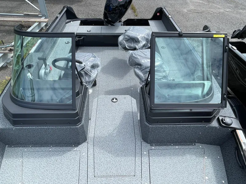 Slide: The Image of 2026 Lund 1800 Explorer Sport boat interior with dual consoles and seating. - 6