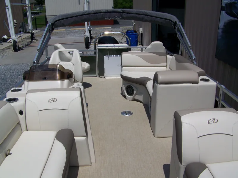 Slide: The Image of 2023 Avalon Venture Rear Fish 20' pontoon boat with spacious seating and modern design. - 3