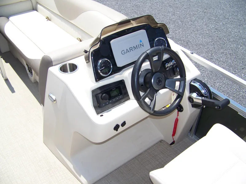 Slide: The Image of 2023 Avalon Venture Rear Fish boat dashboard with Garmin navigation system. - 7