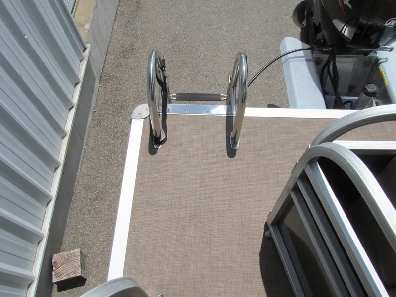 Slide: The Image of 2023 Sun Tracker Party Barge 20 DLX deck with ladder and railing. - 12