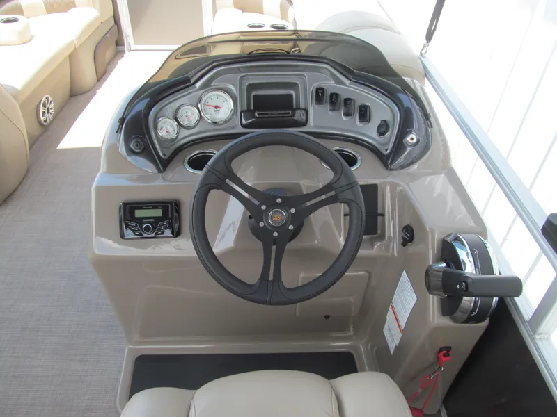 Slide: The Image of 2023 Sun Tracker Party Barge 20 DLX helm with steering wheel and control panel. - 6