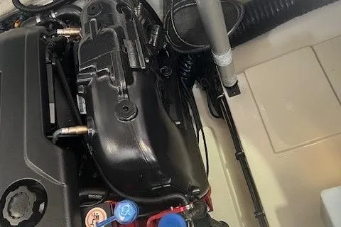 Slide: The Image of Engine compartment of a 2018 Chris-Craft Launch 27 boat, showcasing mechanical components. - 14