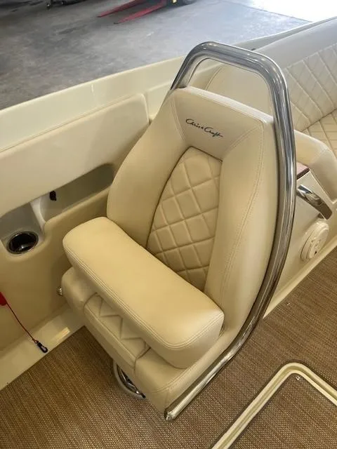 Slide: The Image of 2018 Chris-Craft Launch 27 boat seat with beige upholstery and diamond stitching. - 17