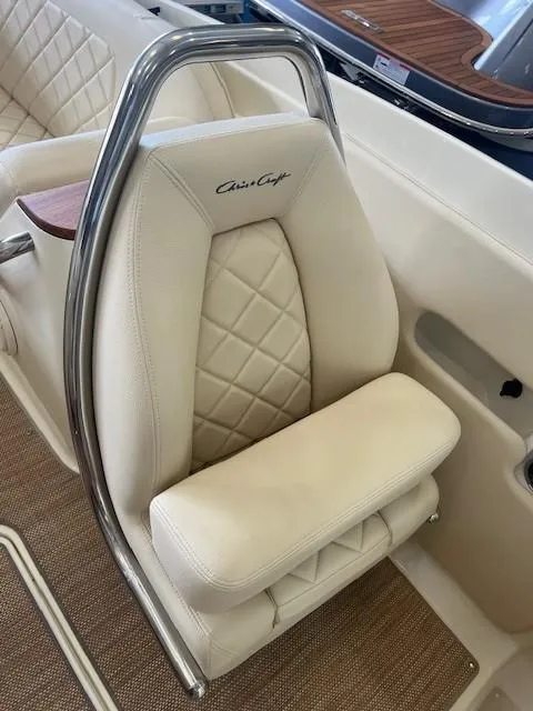 Slide: The Image of 2018 Chris-Craft Launch 27 boat seat with quilted leather and chrome accents. - 18