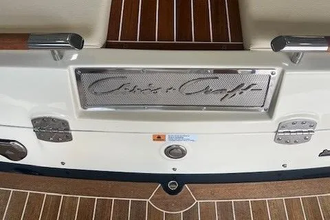 Slide: The Image of 2018 Chris-Craft Launch 27 boat, featuring elegant wood and metal detailing. - 9