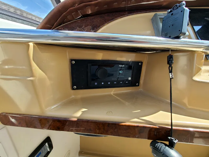 Slide: The Image of Control panel of a 2001 Carver 506 Motor Yacht with electronic display and mounted device. - 13