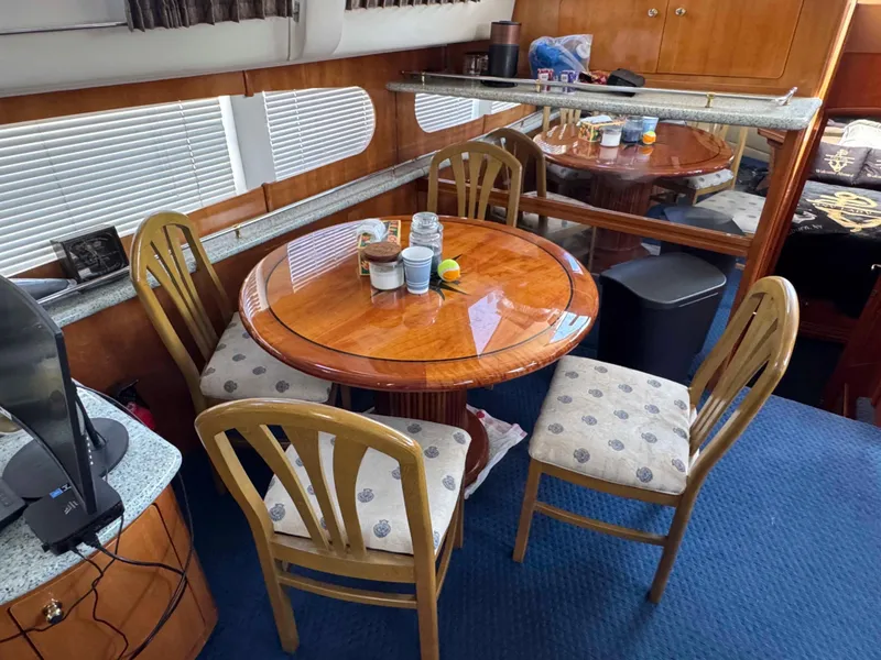 Slide: The Image of Interior of 2001 Carver 506 Motor Yacht with dining table and chairs. - 25