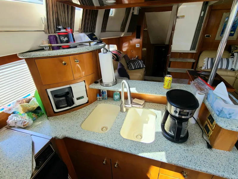 Slide: The Image of Interior of 2001 Carver 506 Motor Yacht kitchen with coffee maker and dual sinks. - 28