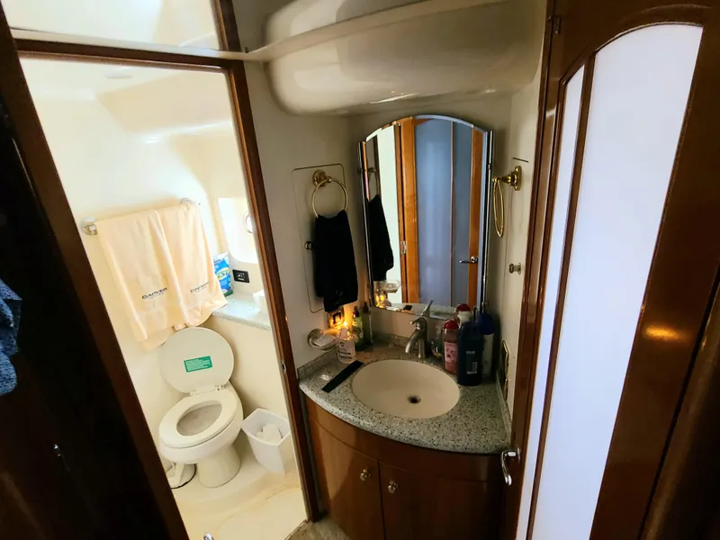 Slide: The Image of Bathroom interior of 2001 Carver 506 Motor Yacht with sink, mirror, and toilet. - 31