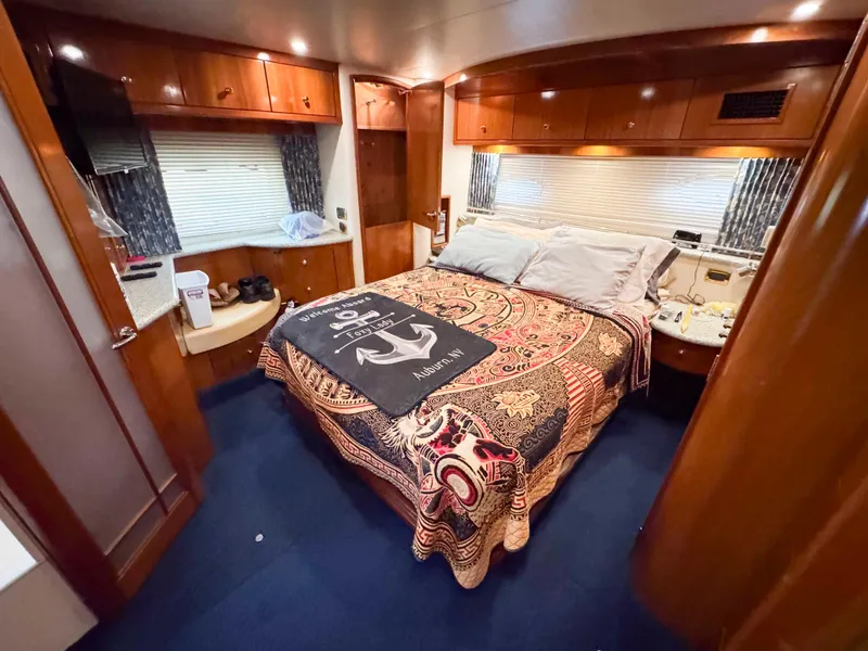 Slide: The Image of Luxurious bedroom interior of 2001 Carver 506 Motor Yacht with elegant decor and cozy bedding. - 32