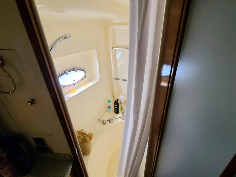 Slide: The Image of Bathroom interior of 2001 Carver 506 Motor Yacht with shower and porthole window. - 37