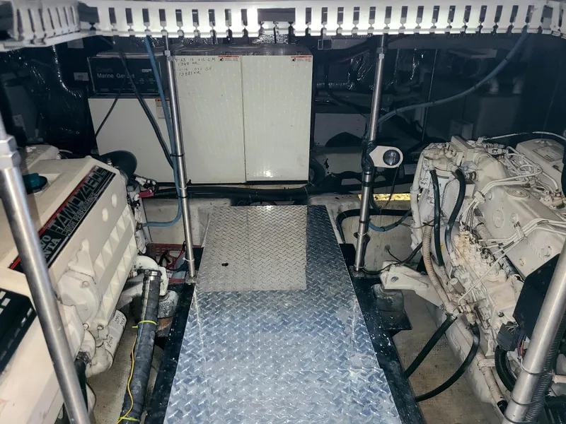 Slide: The Image of Engine room of 2001 Carver 506 Motor Yacht with visible machinery and equipment. - 38