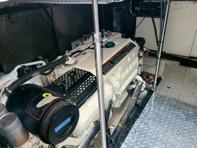 Slide: The Image of Engine room of a 2001 Carver 506 Motor Yacht, featuring a diesel engine. - 40